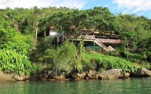 Casa Cairucu, a boutique vacation house in the lush tropical bay of Paraty, Brazil