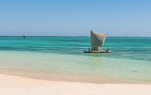the beach in the south-west of Madagascar and a traditional boat