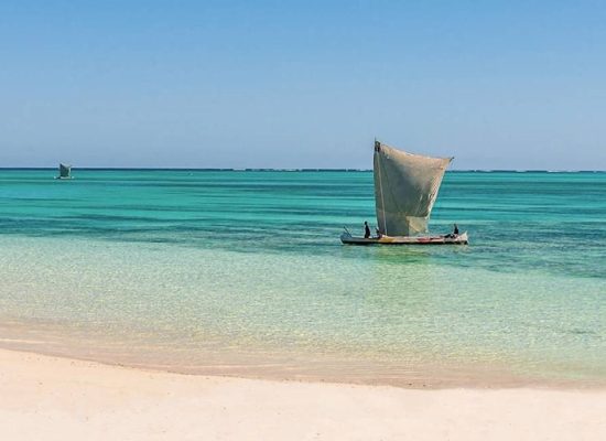 the beach in the south-west of Madagascar and a traditional boat